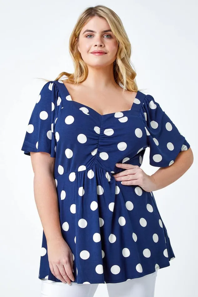 Women Navy Curve Polka Dot Peplum VNeck Stretch Top Roman Tops
