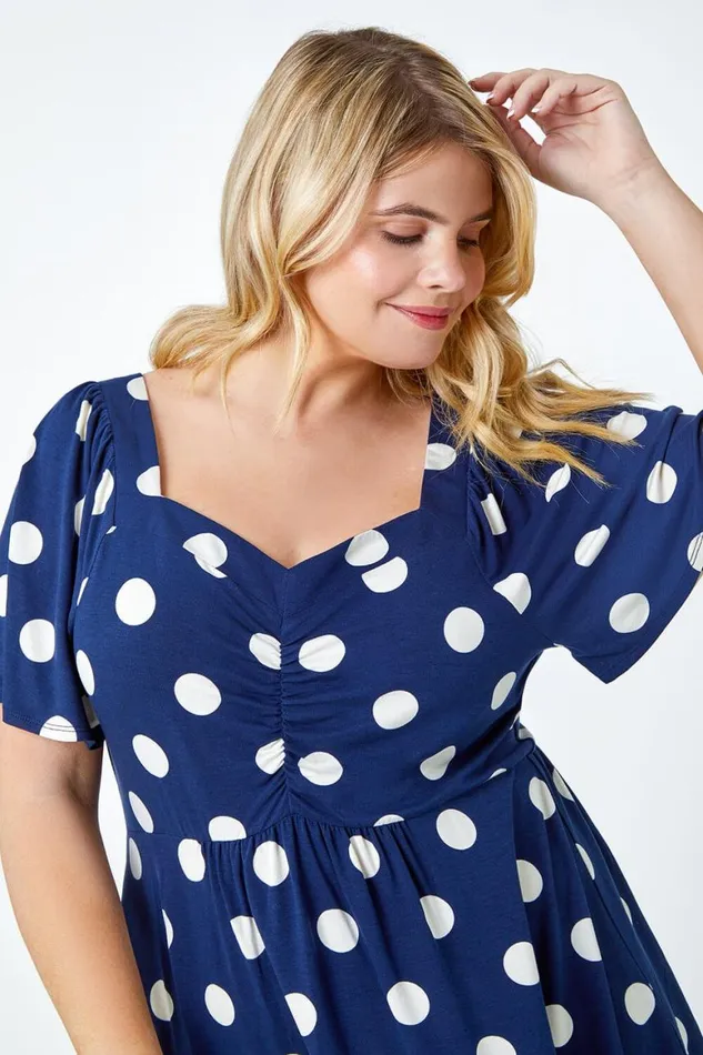 Women Navy Curve Polka Dot Peplum VNeck Stretch Top Roman Tops
