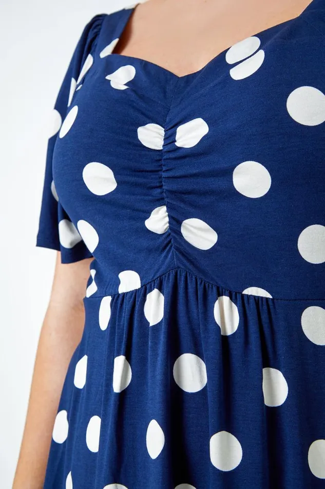 Women Navy Curve Polka Dot Peplum VNeck Stretch Top Roman Tops